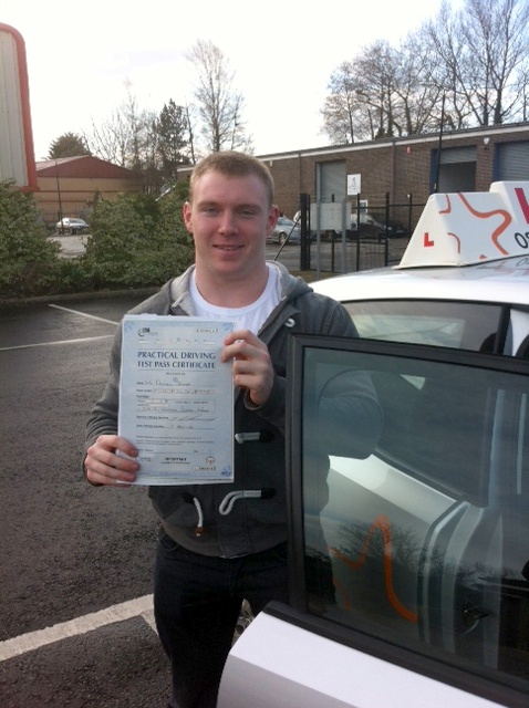 Dan with his Practical Driving Test Pass Certificate outside Weston-super-Mare Driving Test Centre