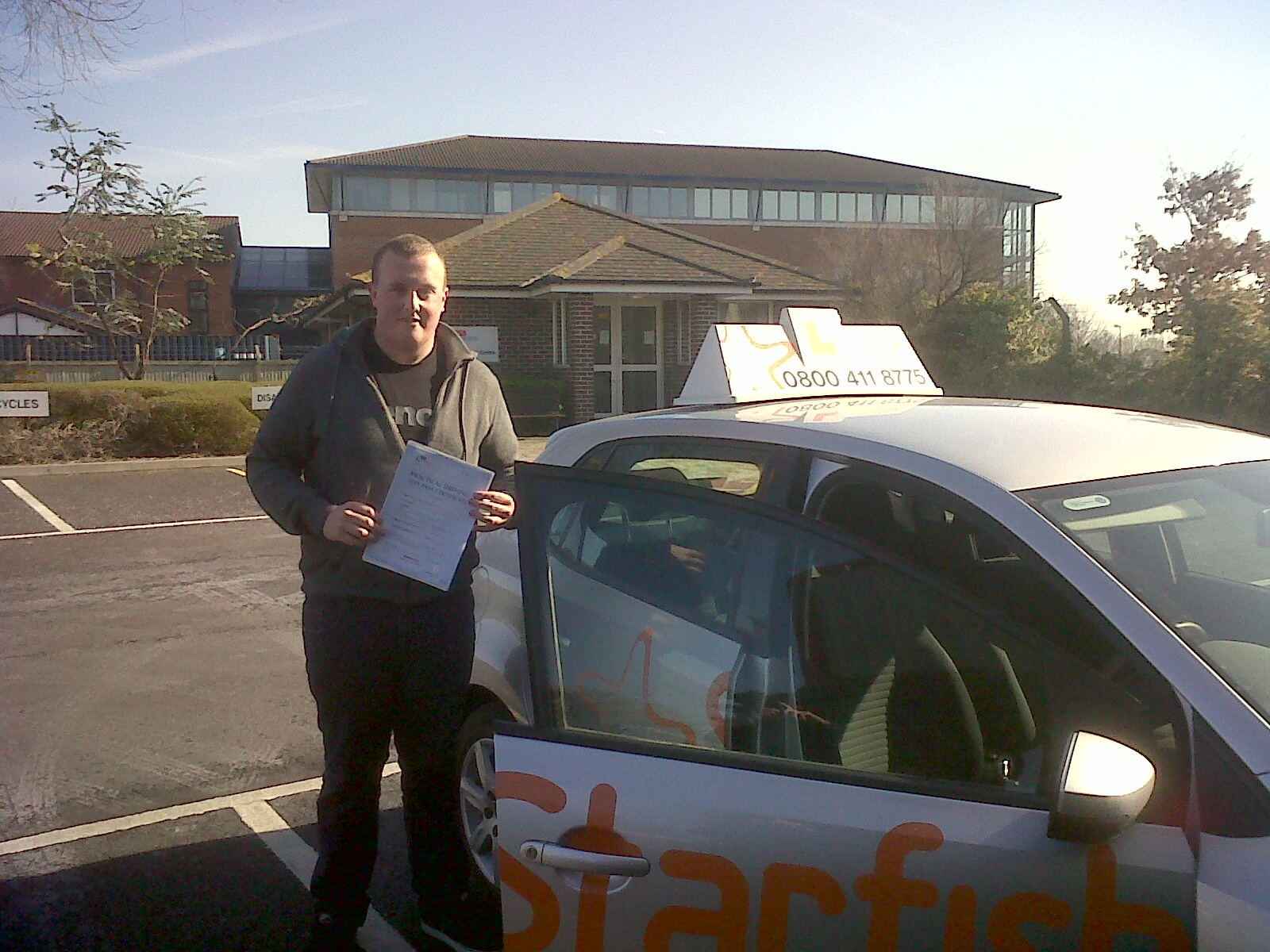 James with his Practical Driving Test Pass Certificate outside Weston-super-Mare Driving Test Centre