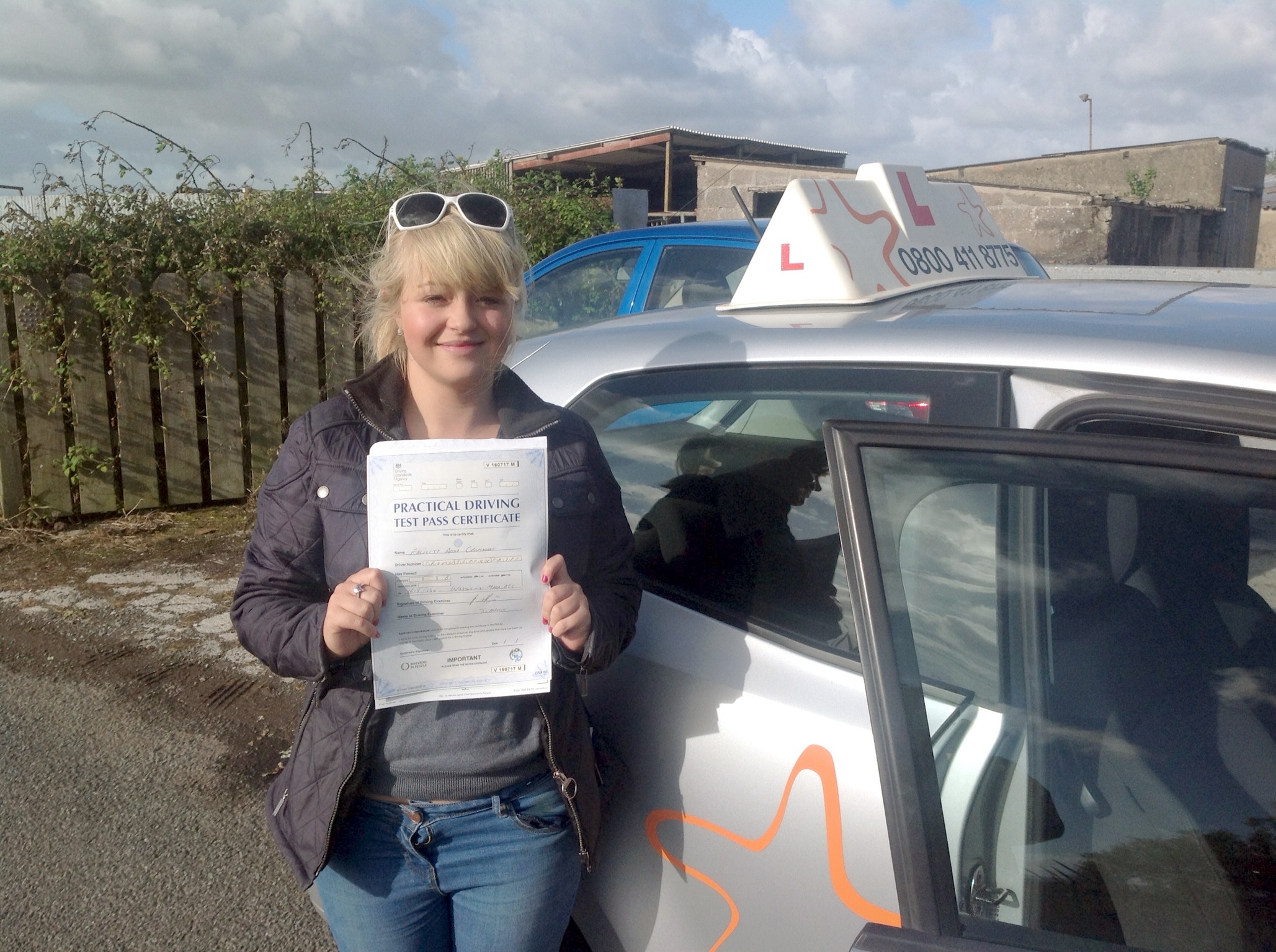 Felicity with her Practical Driving Test Certificate near Weston-super-Mare Driving Test Centre.