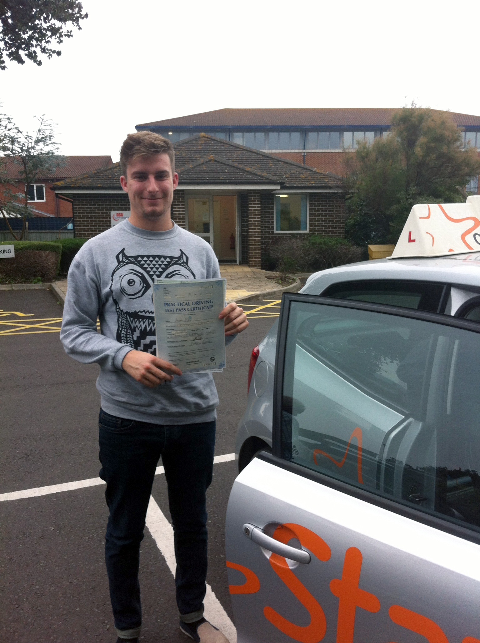 Adam with his Driving Test Pass Certificate outside Weston-Super-Mare Driving Test Centre