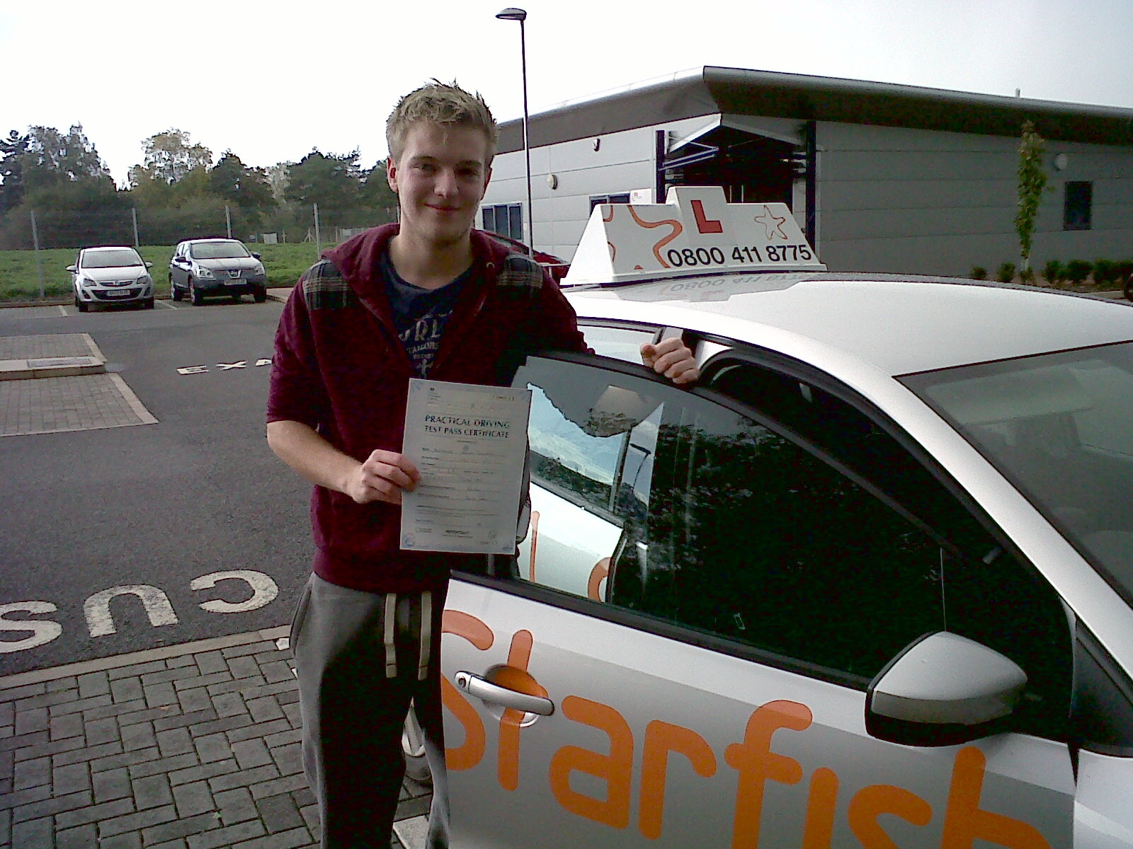 Allie with his Driving Test Pass Certificate outside Taunton Driving Test Centre