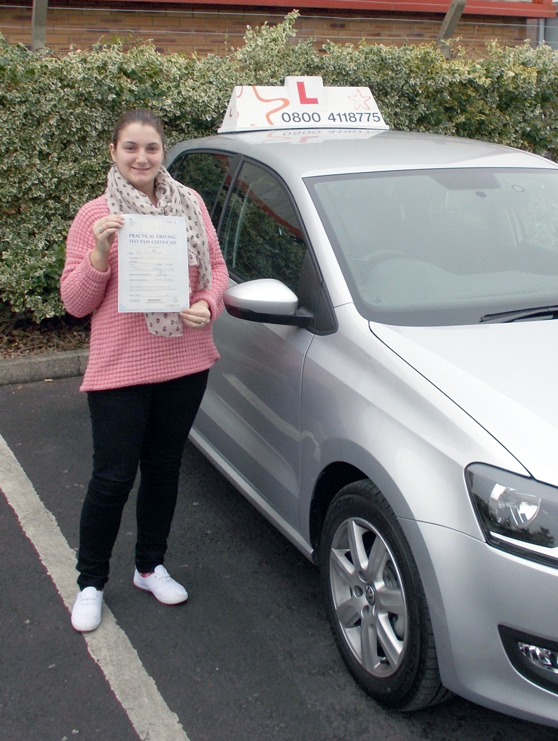 Susan with her Practical Driving Test Pass Certificate outside Weston-Super-Mare Driving Test Centre