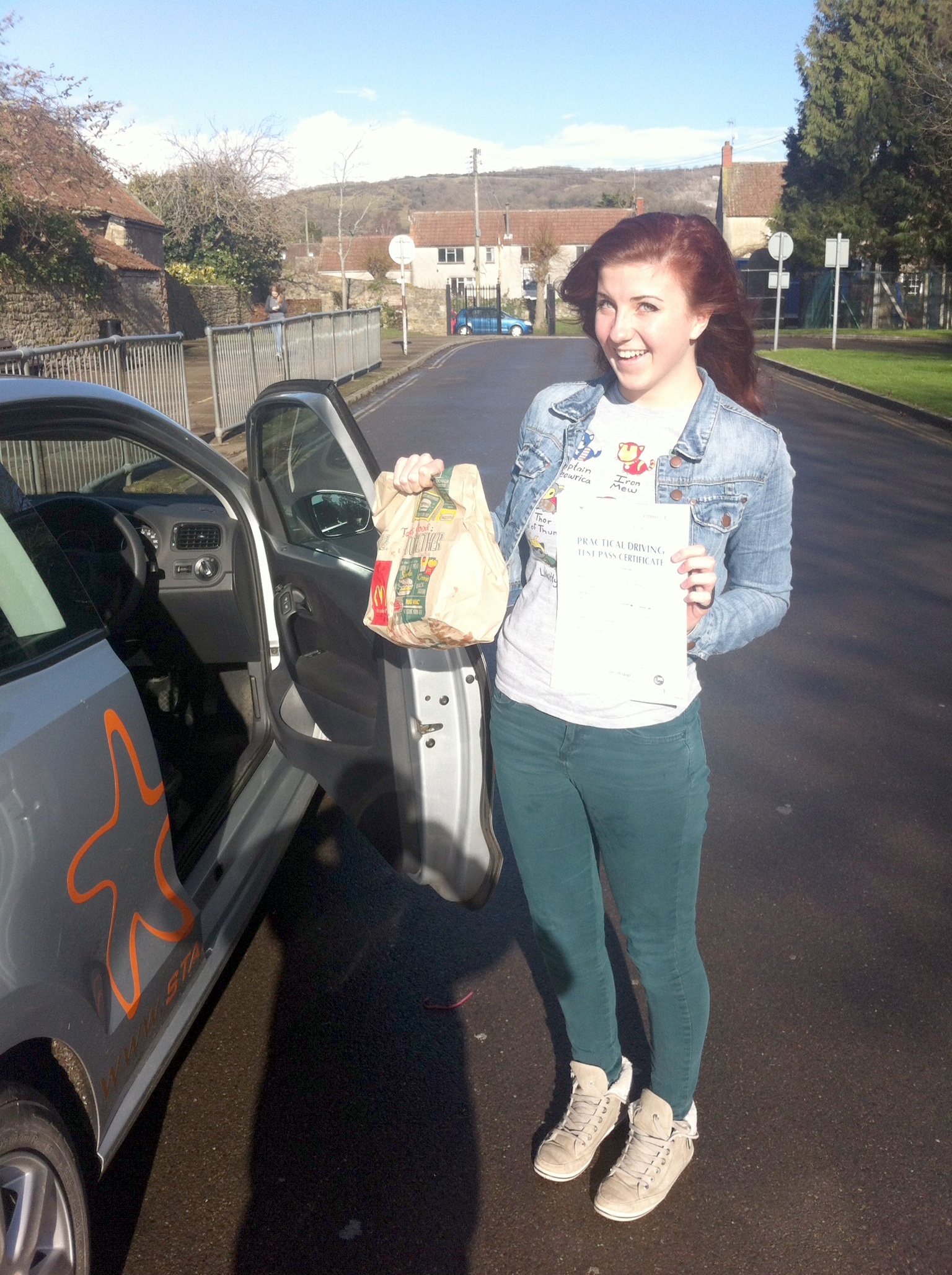 Tabi with her Practical Driving Test Pass Certificate outside McDonalds in Weston-super-Mare