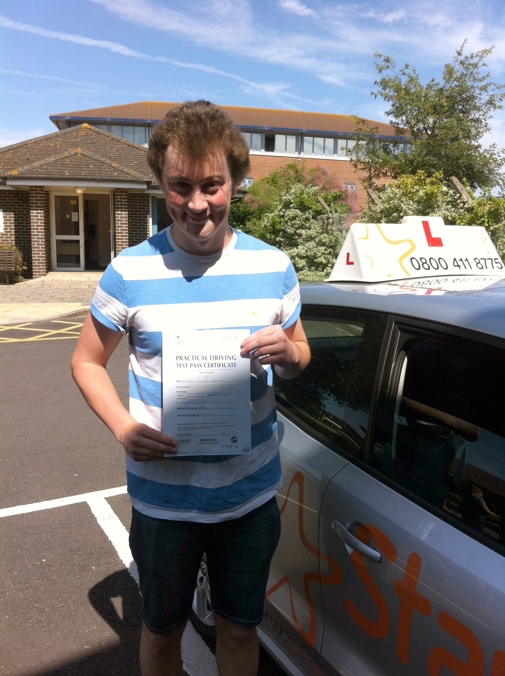 Ben with his Practical Driving Test Pass Certificate outside Weston-super-Mare Driving Test Centre