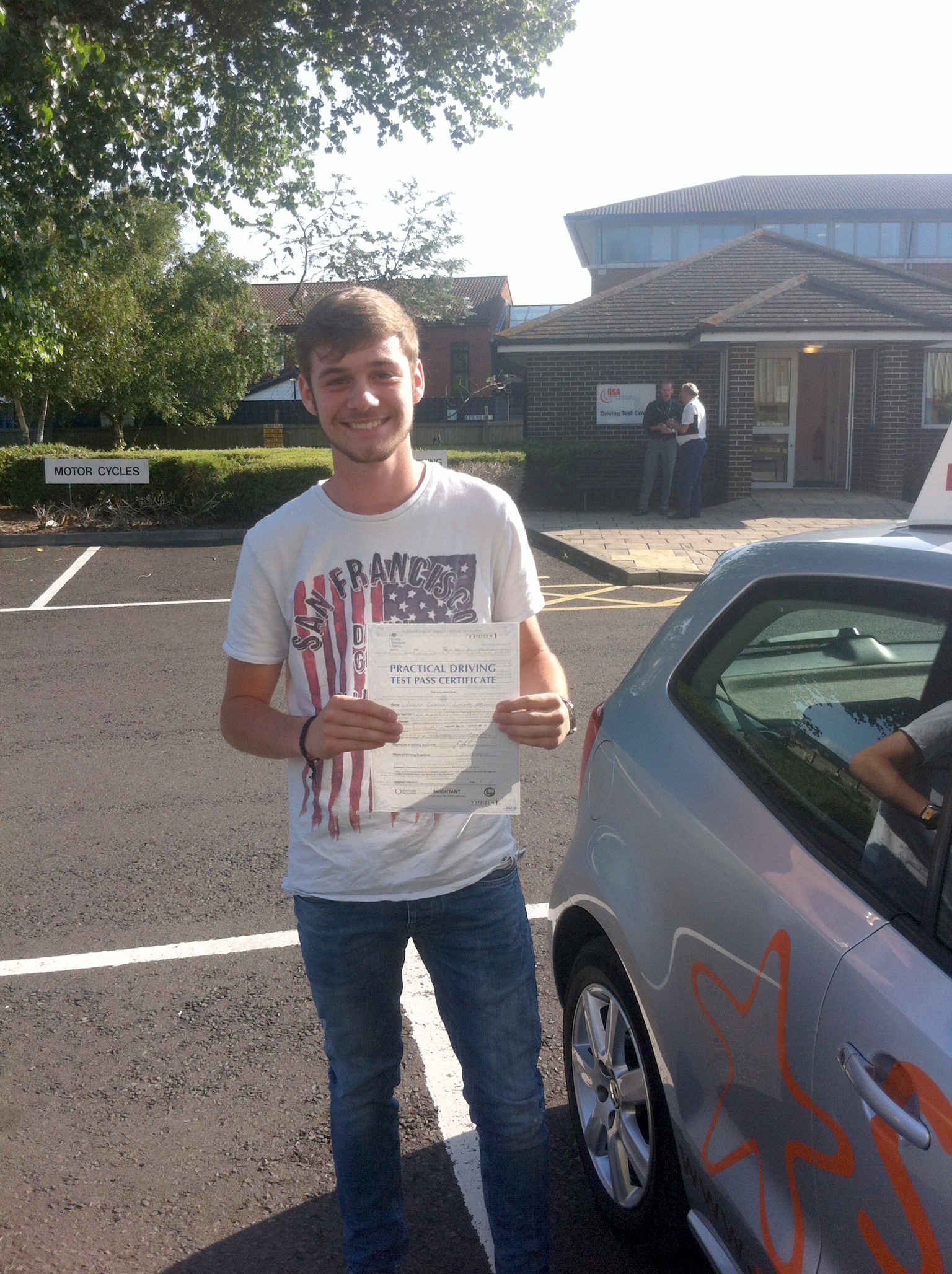 Oliver with his Practical Driving Test Pass Certificate outside Weston-super-Mare Driving Test Centre