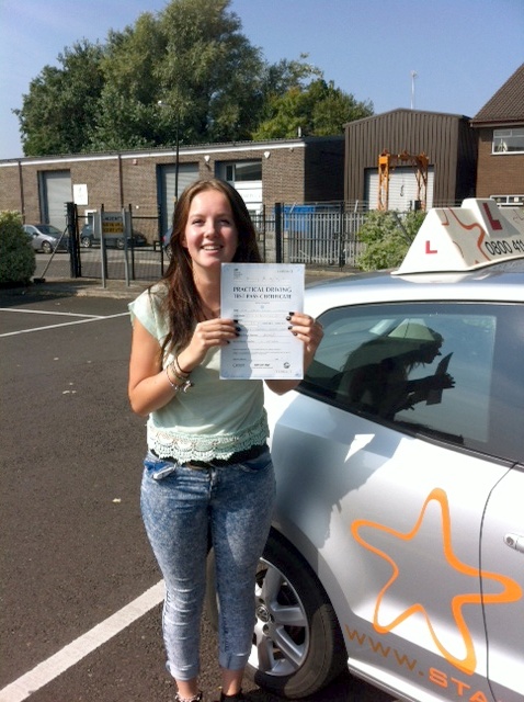 Sarah with her Practical Driving Test Pass Certificate outside Weston-Super-Mare Driving Test Centre
