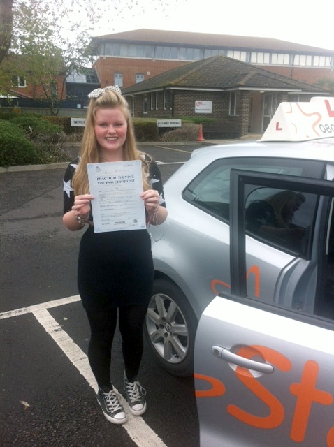Clara with her Practical Driving Test Pass Certificate outside Weston-super-Mare Driving Test Centre