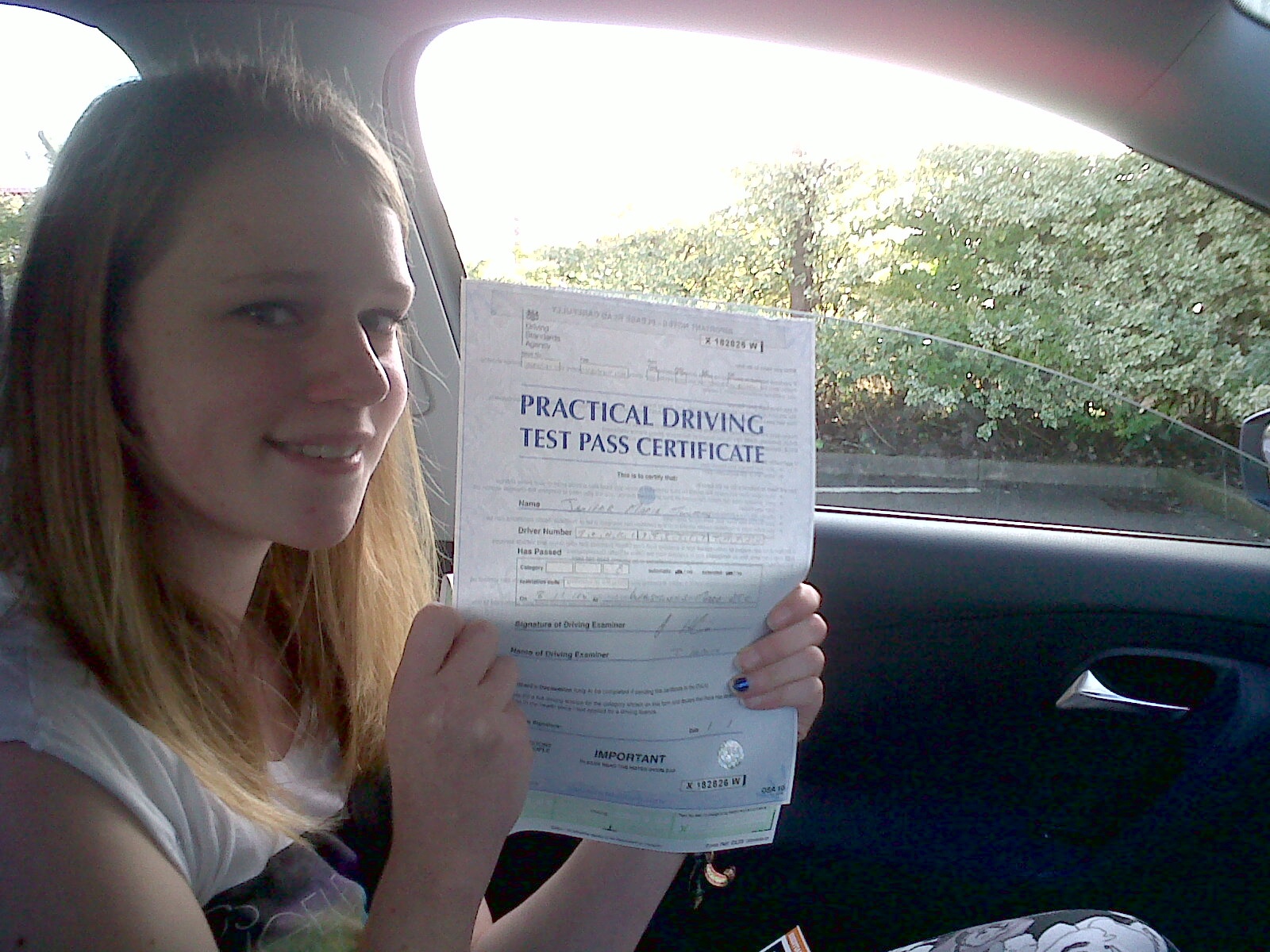 Jenifer with her Practical Driving Test Pass Certificate outside Weston-super-Mare Driving Test Centre