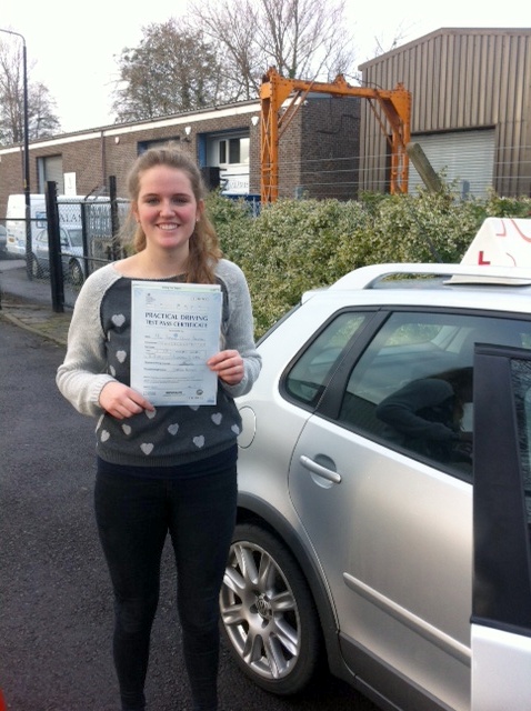 Shannon with her Practical Driving Test Pass Certificate outside Weston-super-mare Driving Test Centre.