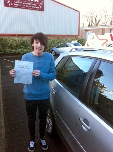 John with his Practical Driving Test Pass Certificate outside Weston-super-Mare Driving Test Centre