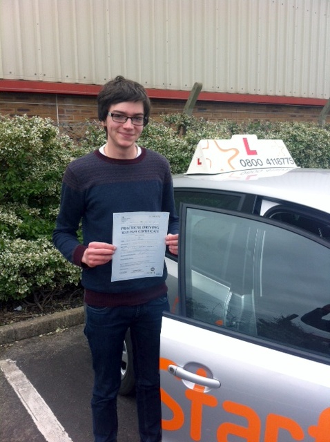 Jack with his Practical Driving Test Pass Certificate outside Weston-super-Mare Driving Test Centre