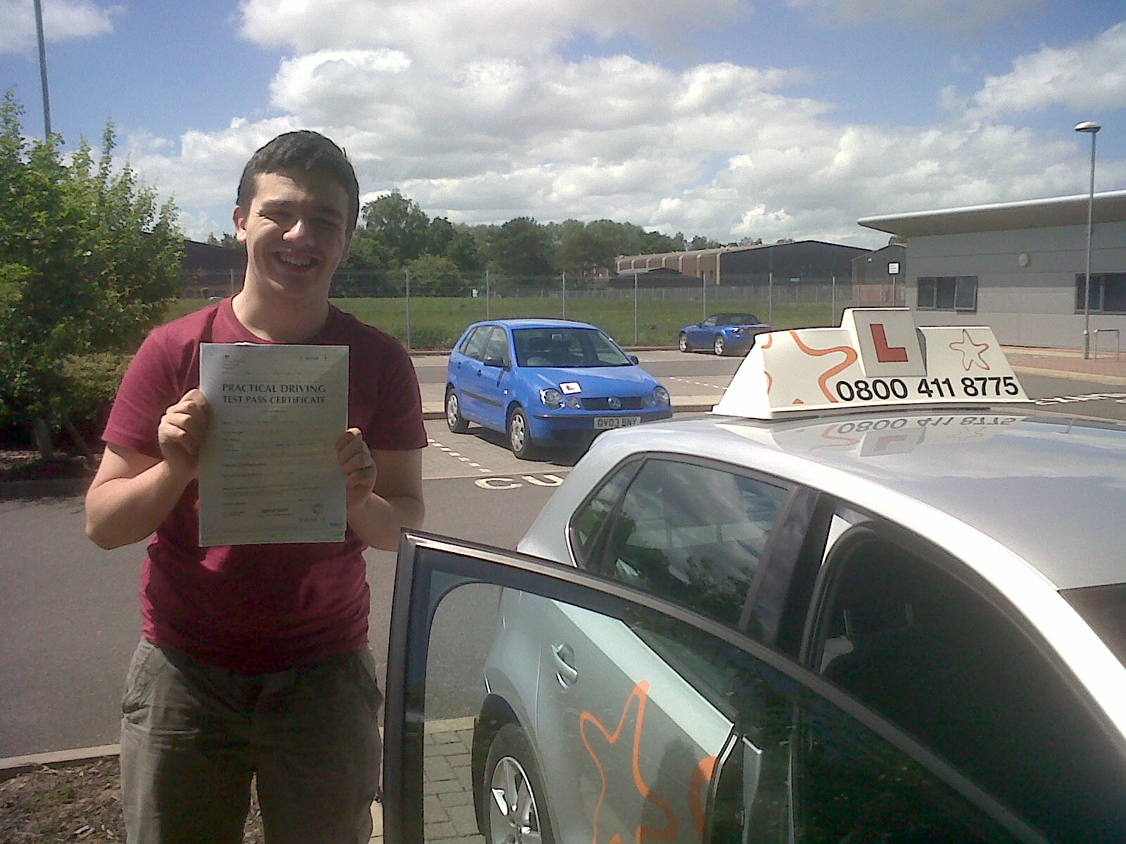 Douglas with his Practical Driving Test Pass Certificate outside Taunton Driving Test Centre