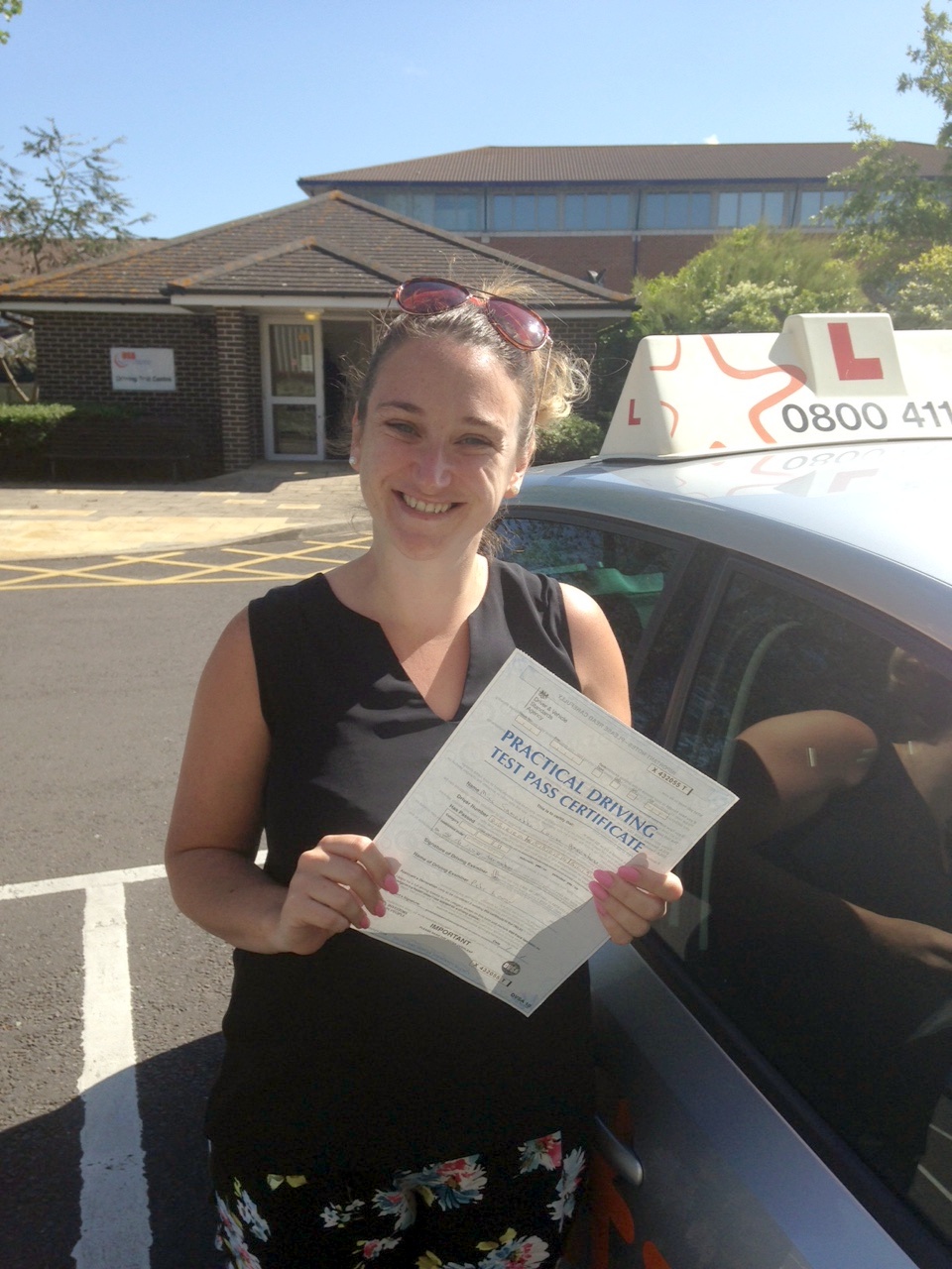 Sam with her Practical Driving Test Pass Certificate outside Weston-super-mare Driving Test Centre