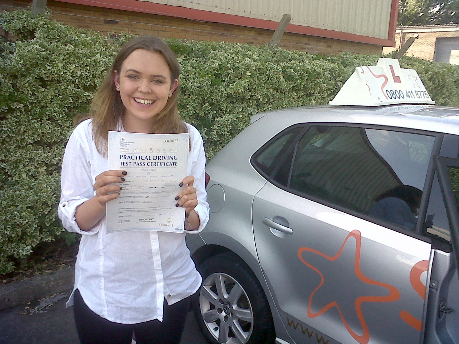 Chelsea with her Practical Driving Test Pass Certificate outside Weston-super-Mare Driving Test Centre