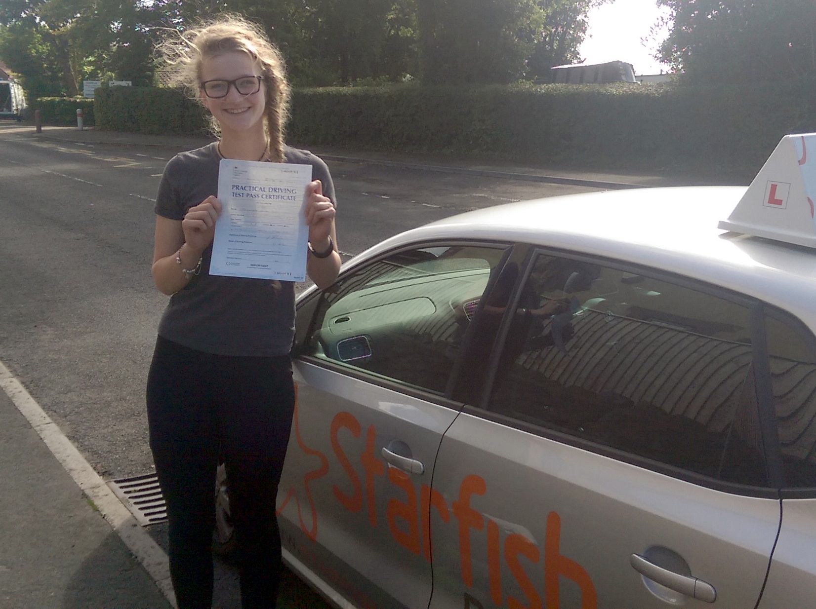 Lizzie with her Practical Driving Test Pass Certificate somewhere in Shipham.