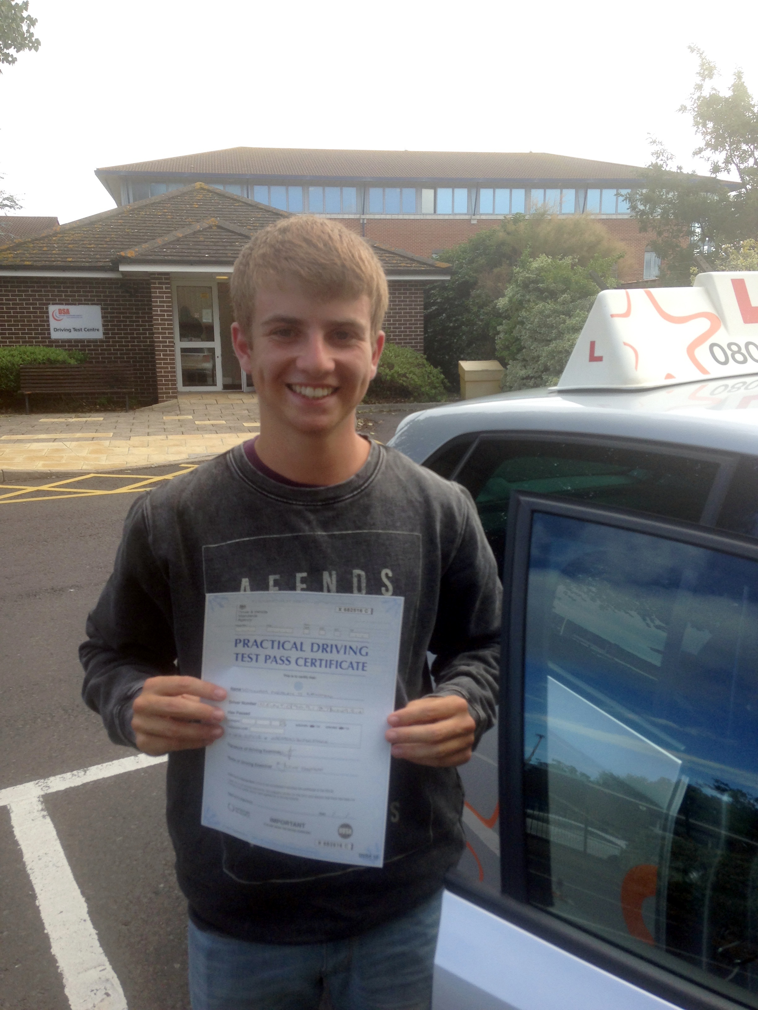 Will with his Practical Driving Test Pass Certificate outside Weston-super-Mare Driving Test Centre