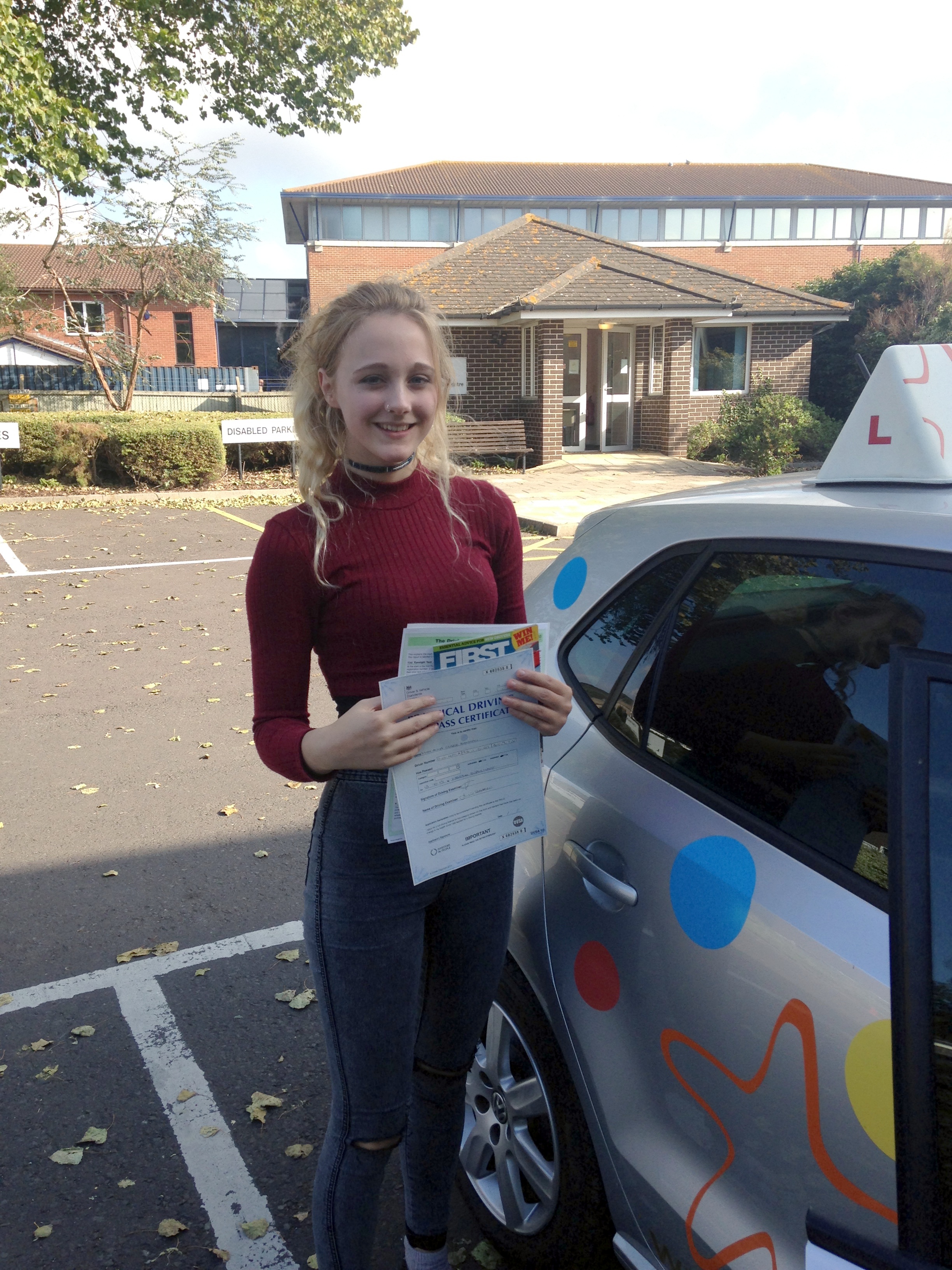 Anna with her Practical Driving Test Pass Certificate outside Weston-super-Mare Driving Test Centre.