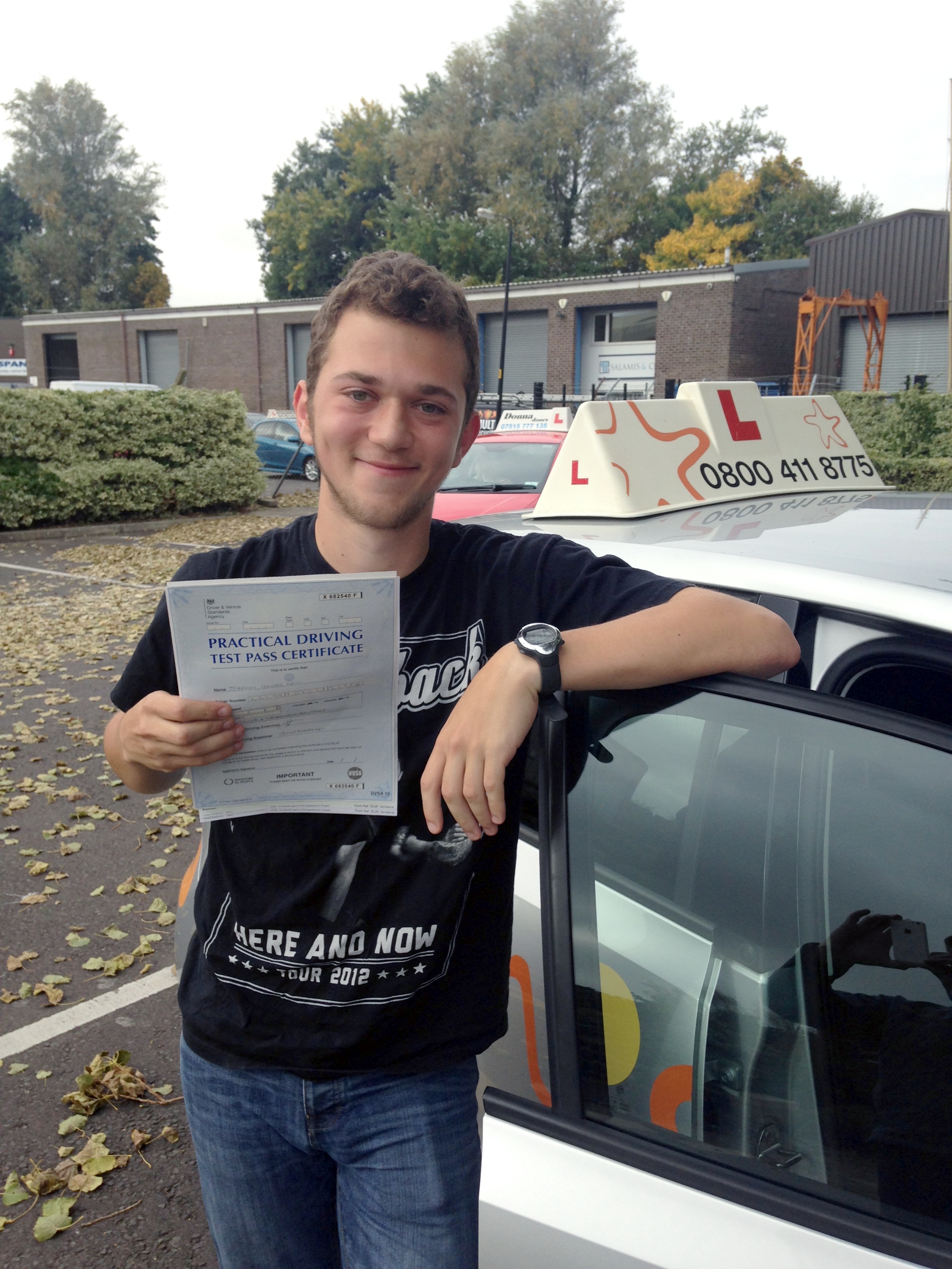 Steven with his Practical Driving Test Pass Certificate outside Weston-super-Mare Driving Test Centre
