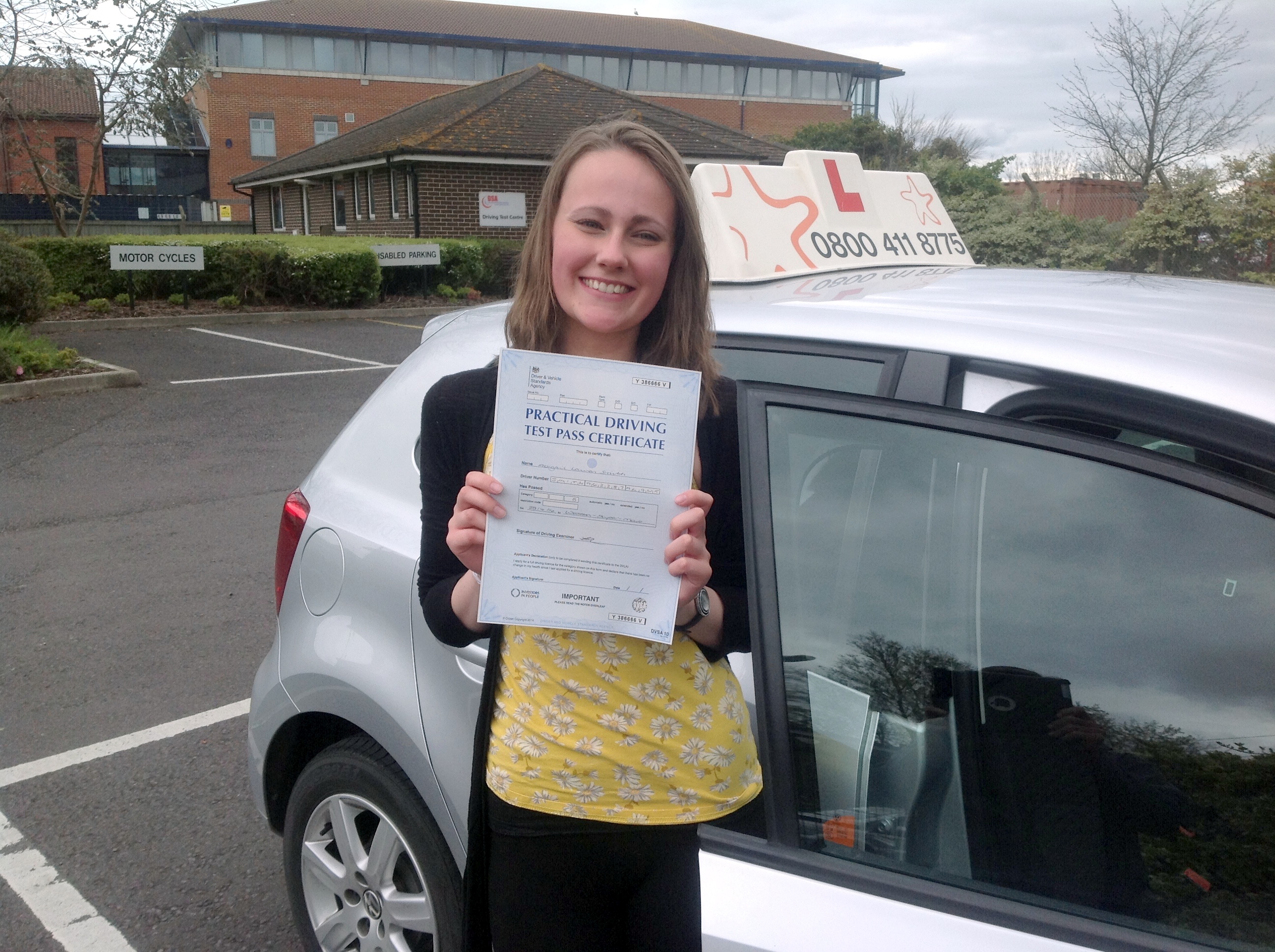 Abigail with her Practical Pass Test Certificate outside Weston-Super-Mare Driving Test Centre
