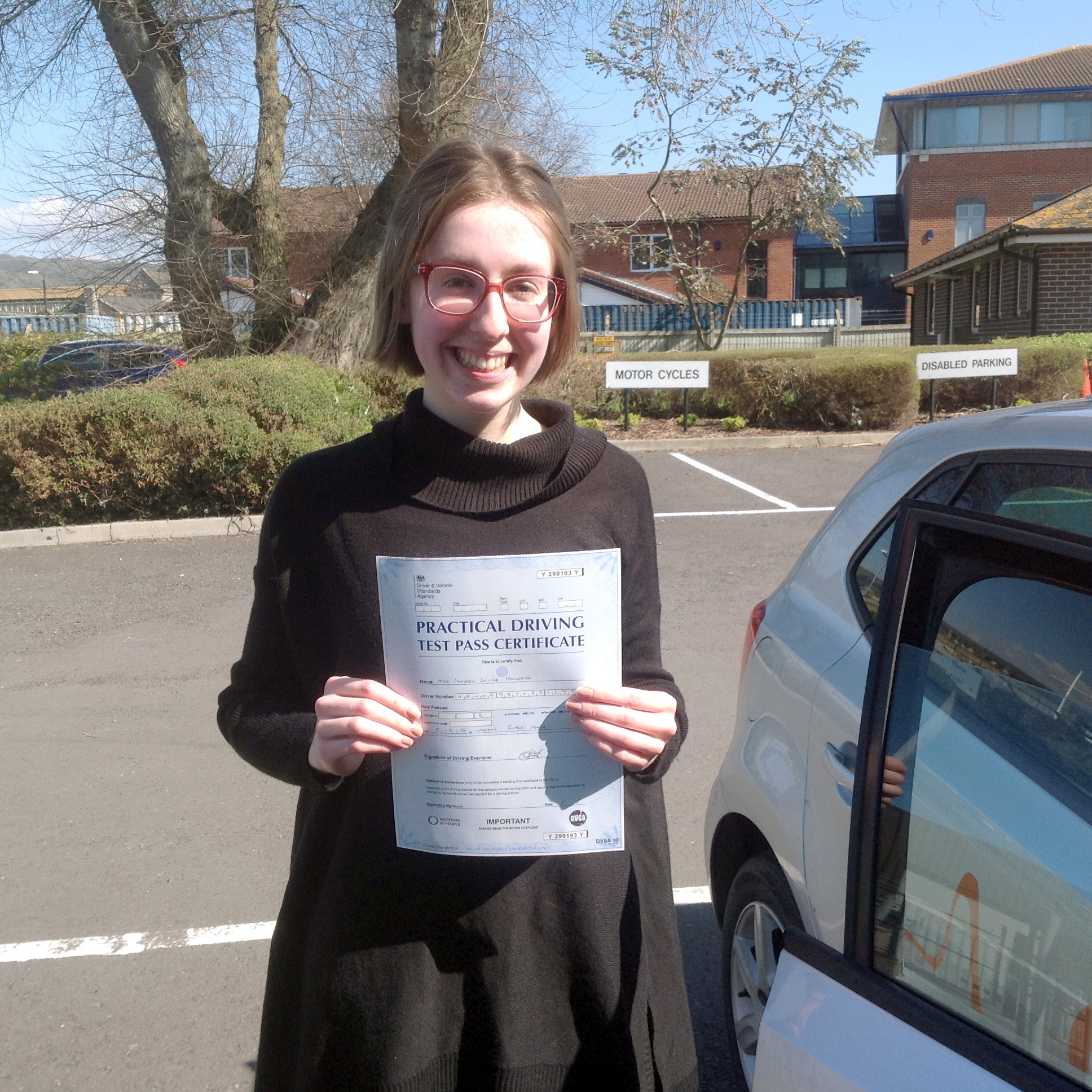 Imogen with her Pracitcal Drving Test Pass Certificate outside Weston-Super-Mare Driving Test Centre