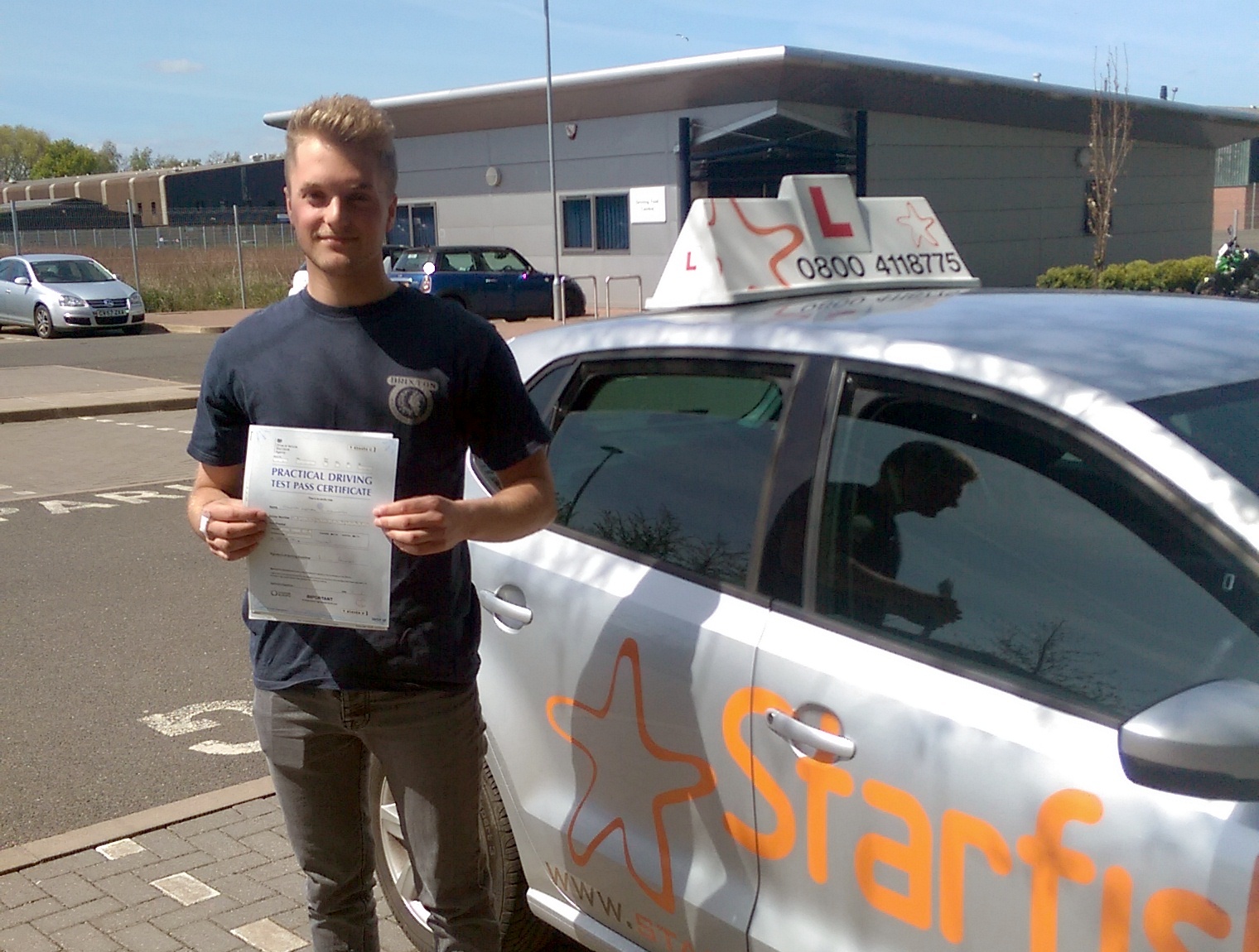 Tom with his Practical Driving Test Pass Certificate outside Taunton Driving Test Centre