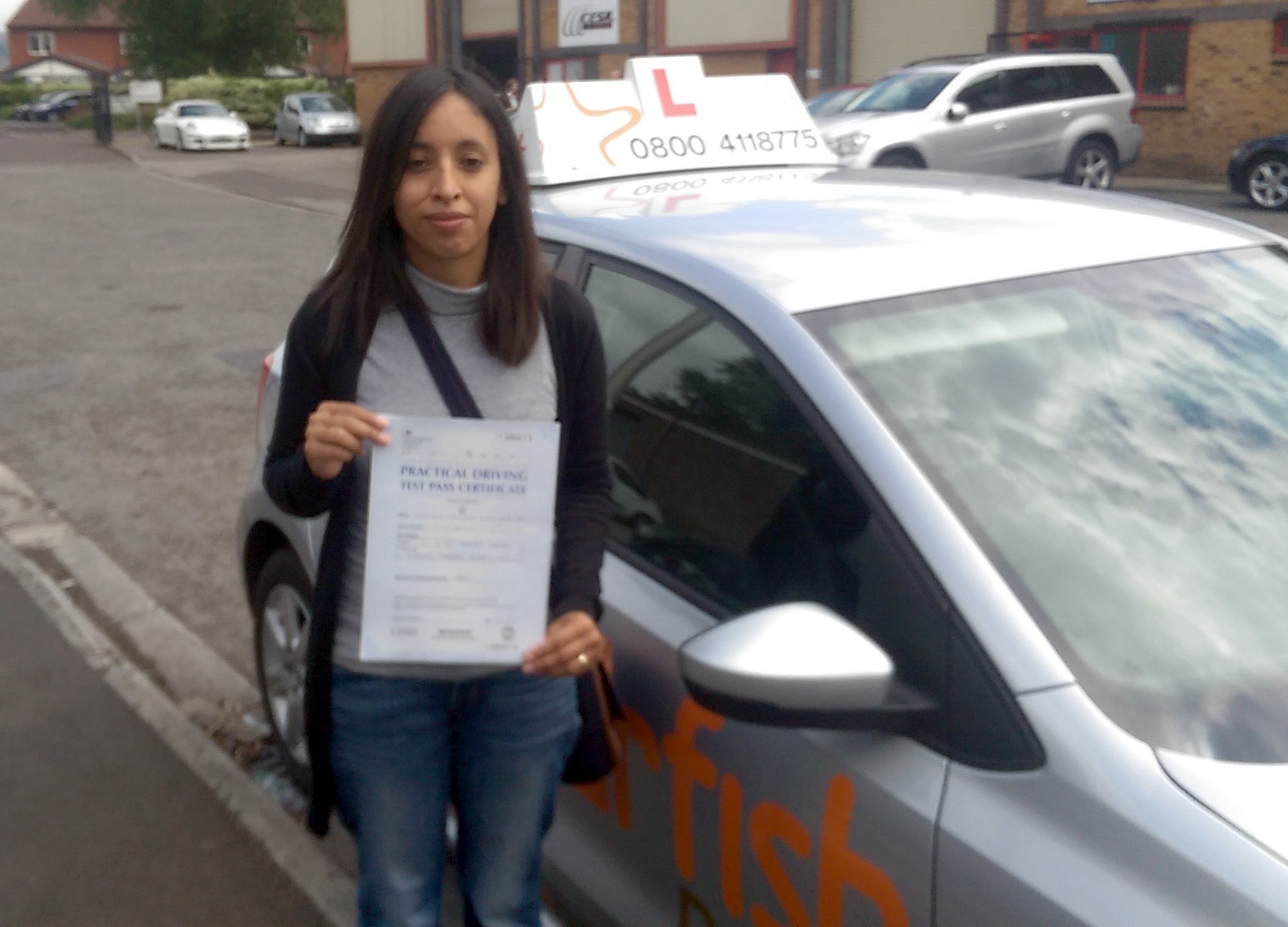 Claudia with her Practical Driving Test Pass Certificate outside Weston-super-mare Driving Test Centre.