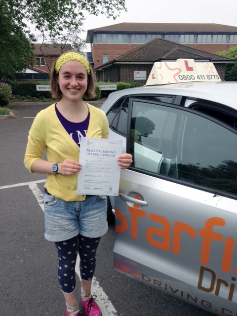 Phoebe with her Practical Driving Test Pass Certificate outside Weston-Super-Mare Driving Test Centre
