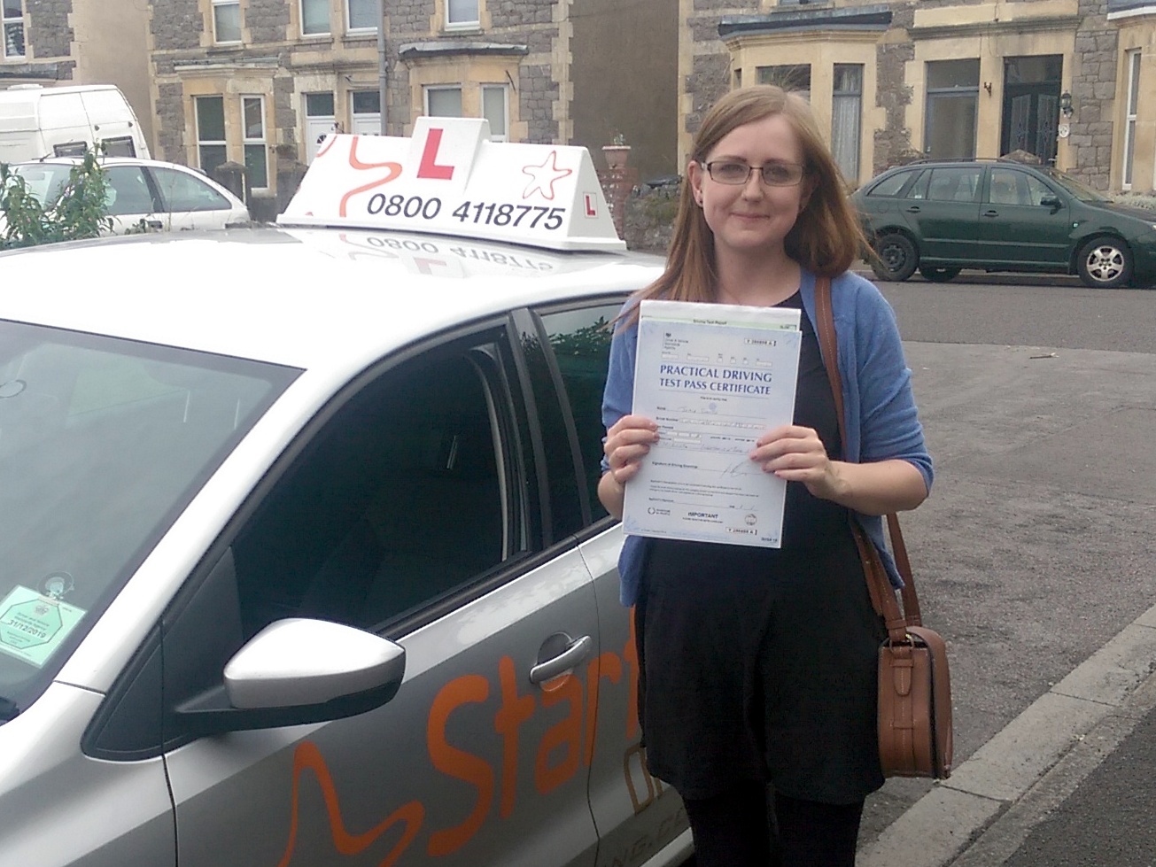Jodie with her Practical Driving Test Pass Certificate somewhere in Weston-super-Mare