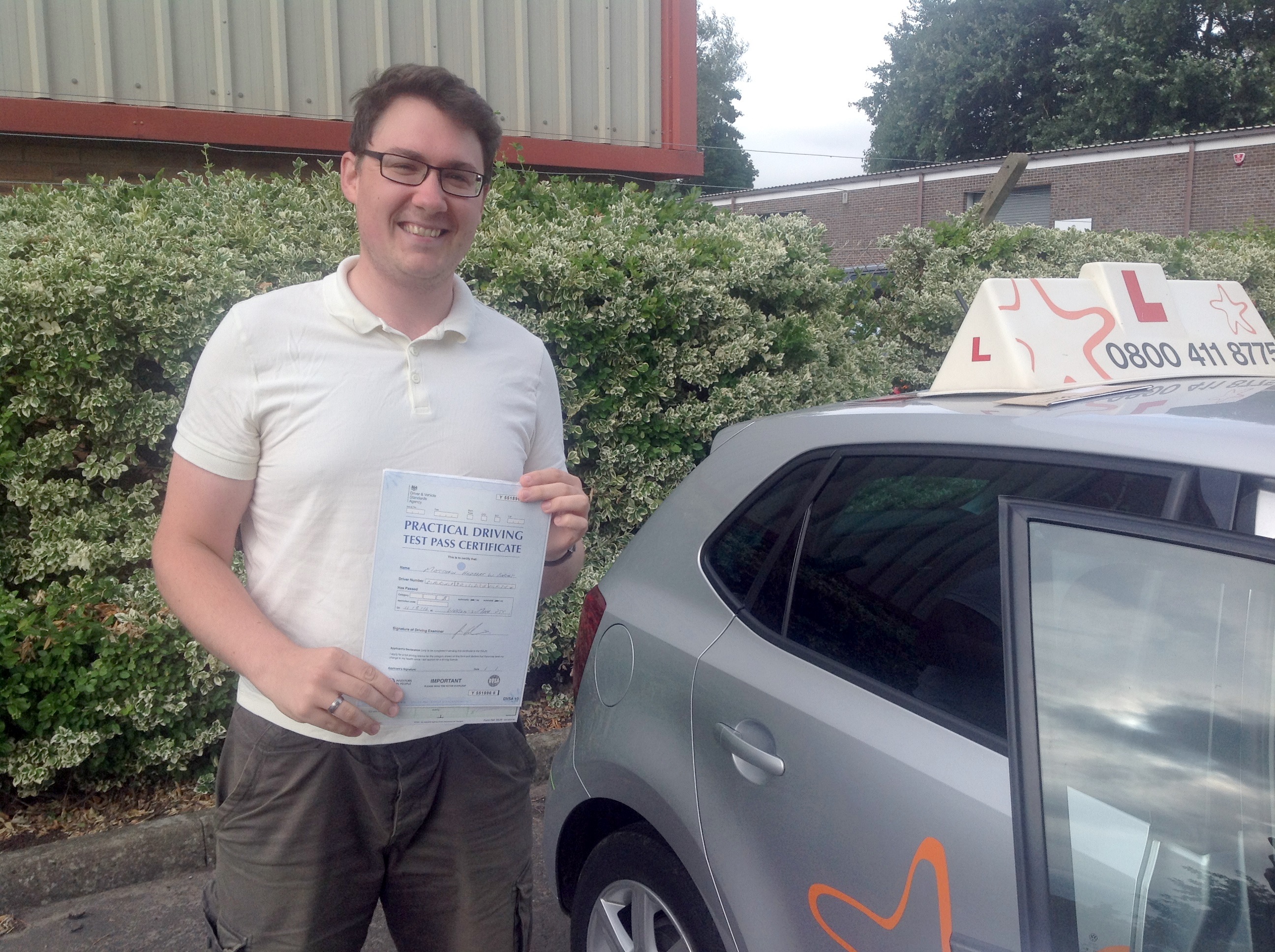 Matthew with his Practical Driving Test Pass Certificate outside Weston-super-mare Driving Test Centre