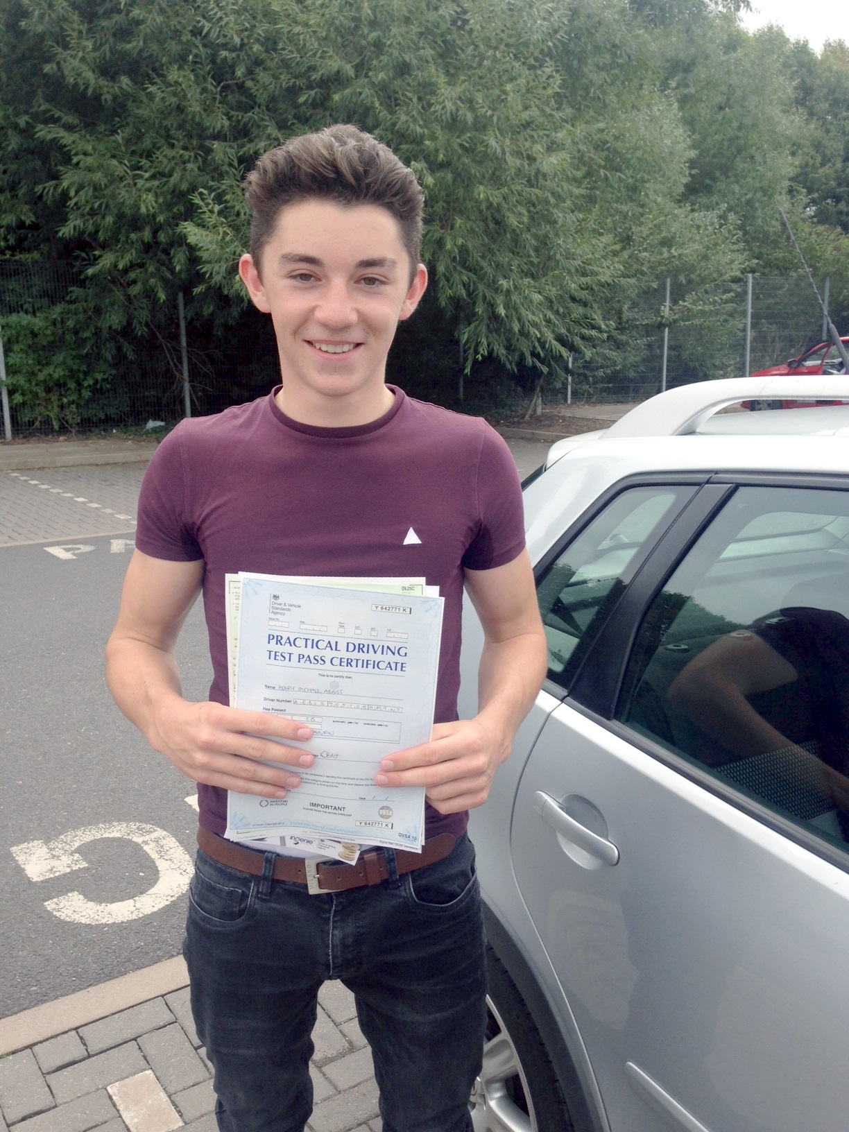 Henry with his Practical Driving Test Pass Certificate outside Taunton Driving Test Centre