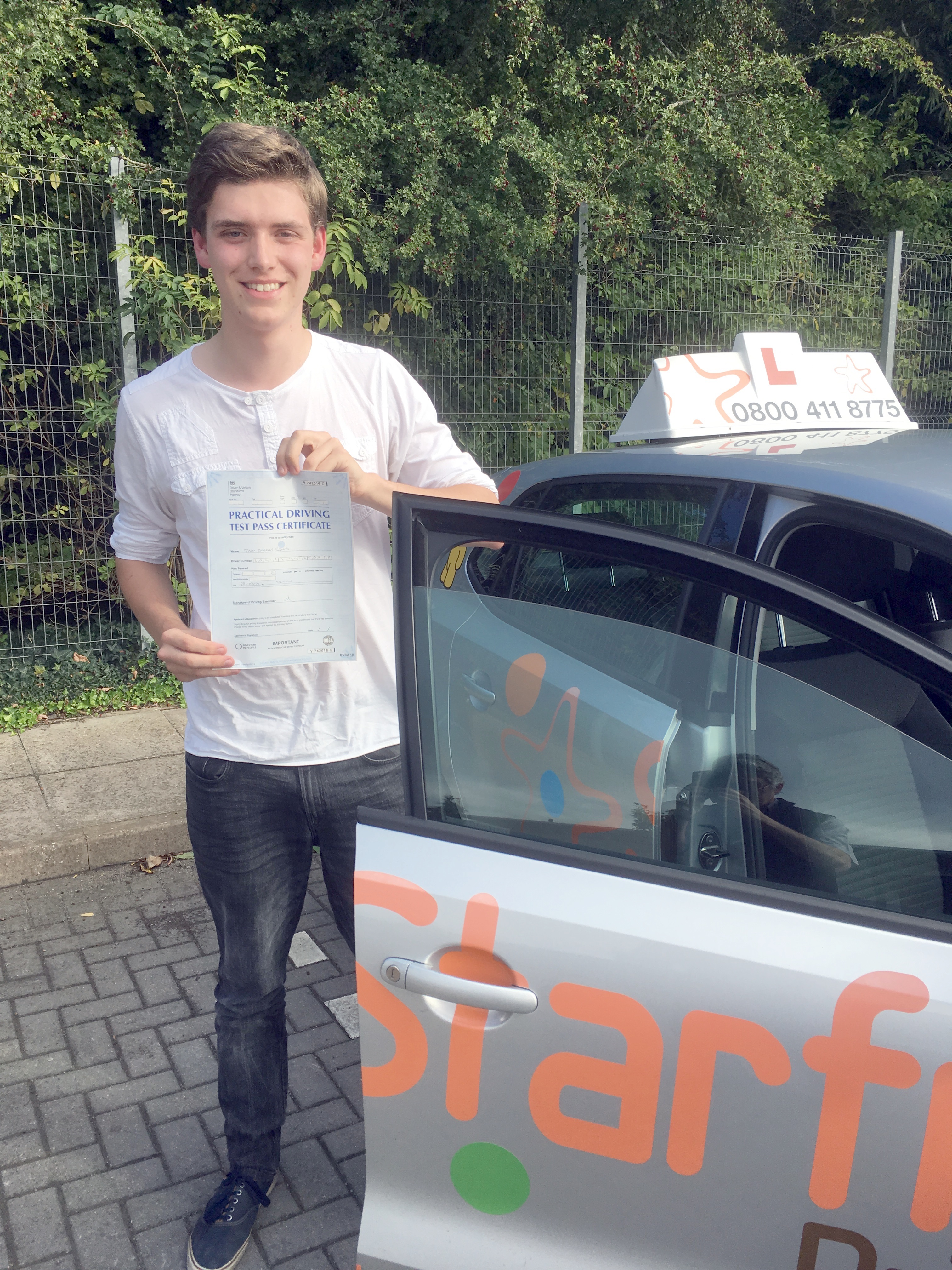 Jack with his Practical Driving Test Pass Certificate outside Taunton Driving Test Centre