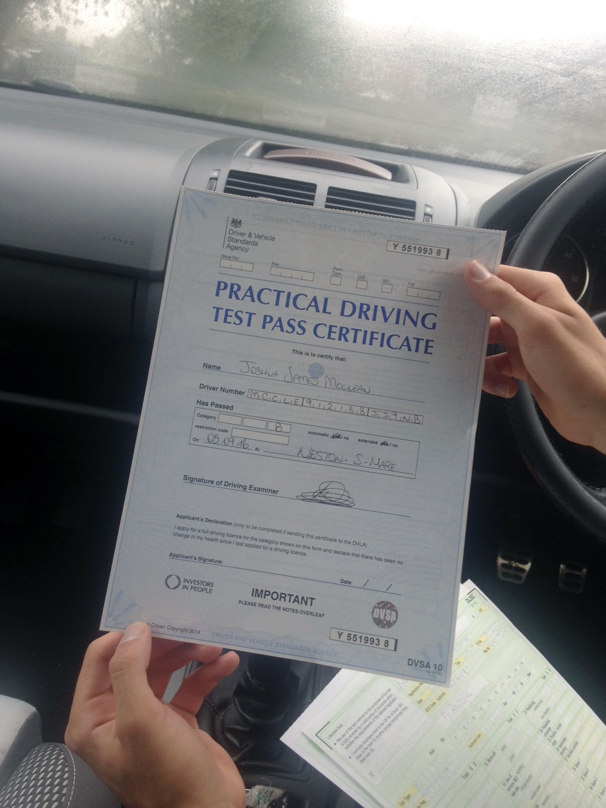 Josh with his Practical Driving Test Pass Certificate.