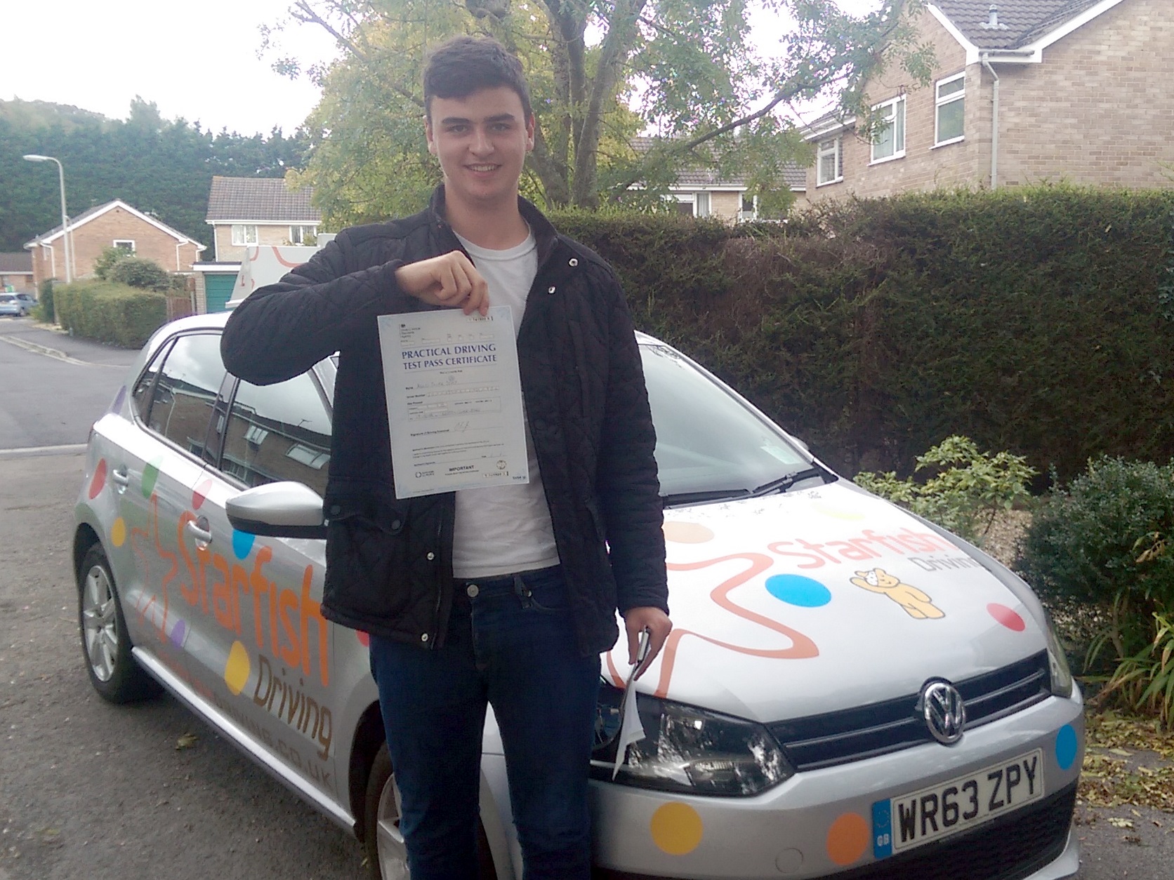 Ashley with his Practical Driving Test Pass Certificate