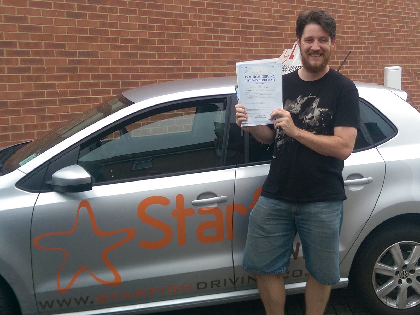 Rich with his Practical Driving Test Pass Certificate somewhere in Weston-Super-Mare