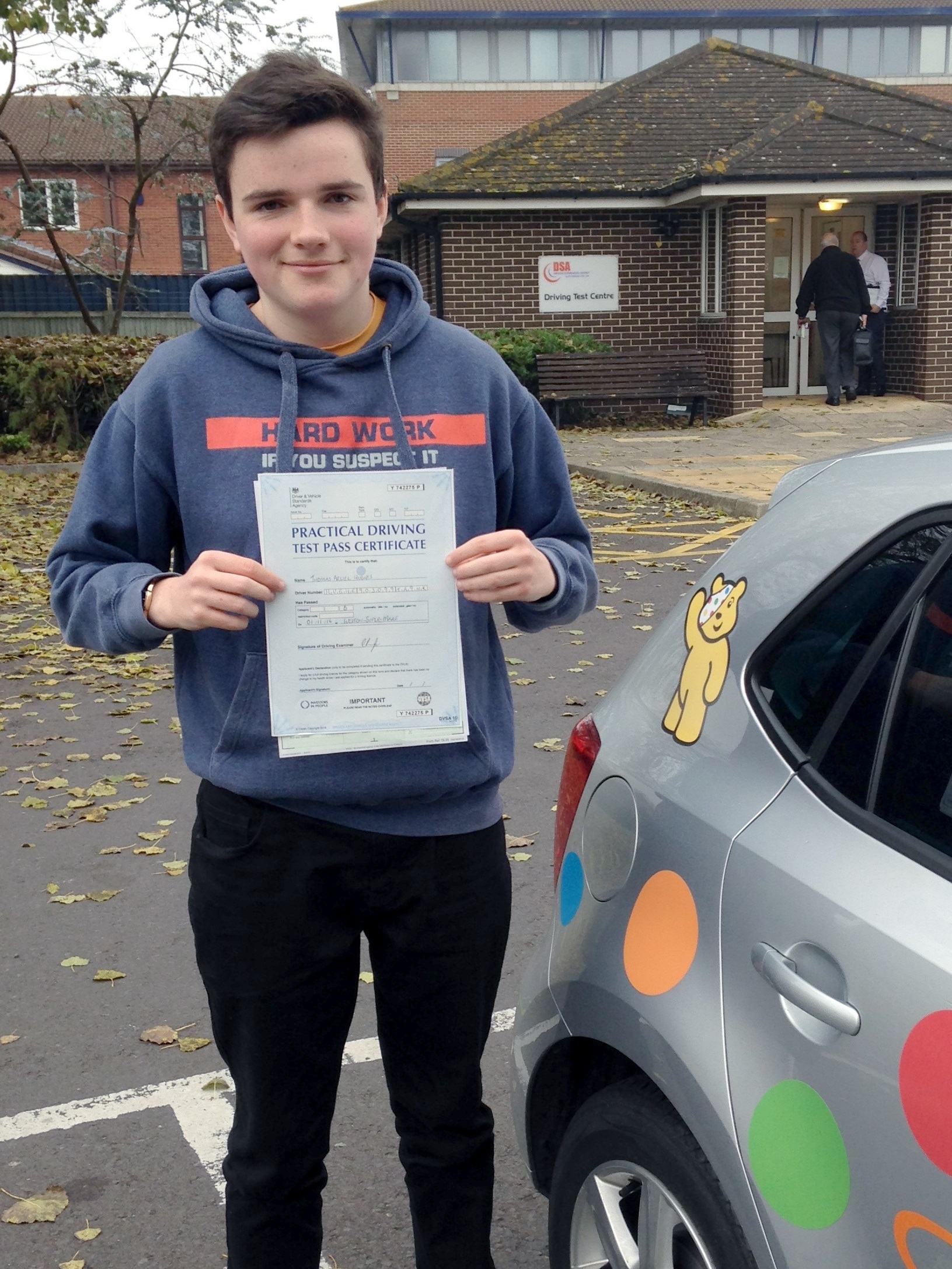 Tom with his Practical Driving Test Pass Certificate outside Weston-Super-Mare Driving Test Centre