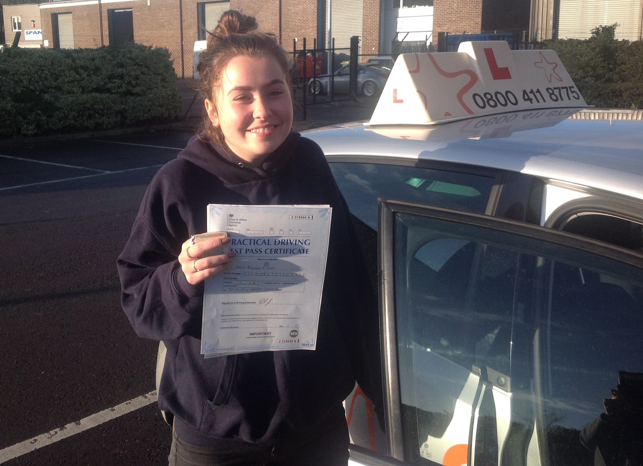 Emily with her Practical Driving Test Pass Certificate outside Weston-super-mare Driving Test Centre