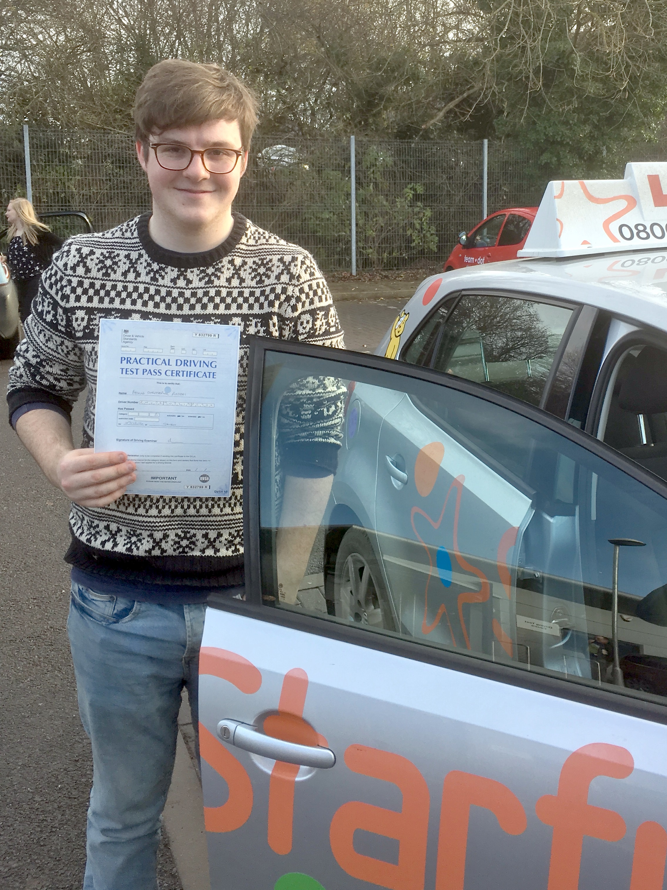 Fergus with his Practical Driving Test Pass Certificate outside Taunton Driving Test Centre