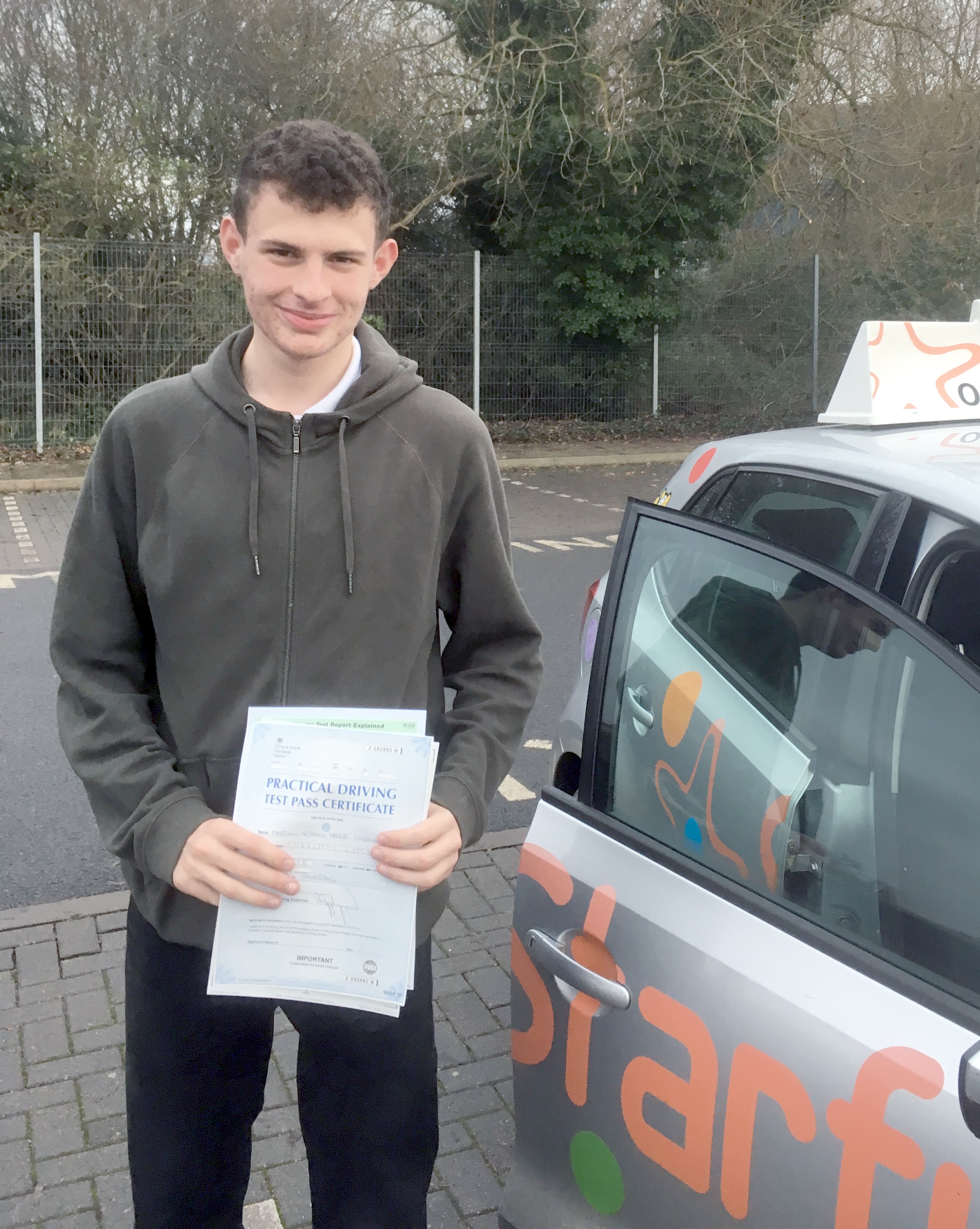 Matt with his Practical Driving Test Pass Certificate outside Taunton Driving Test Centre