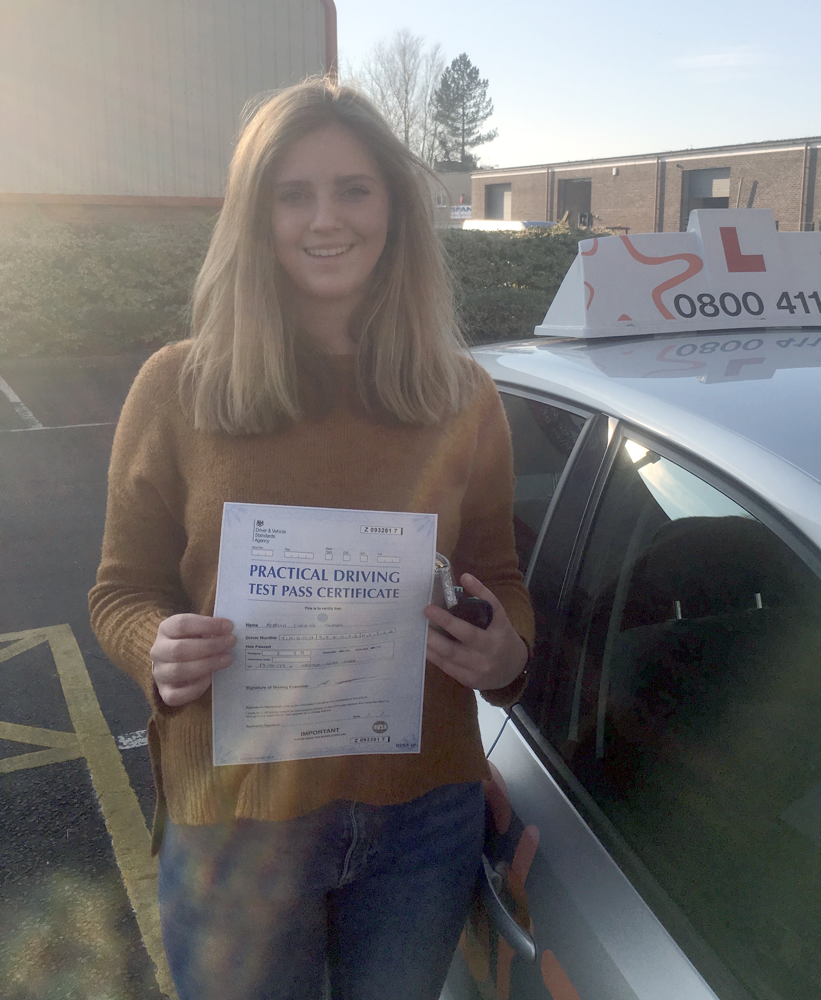 Becca with her Practical Driving Pass Certificate outside Weston-Super-Mare Driving Test Centre.