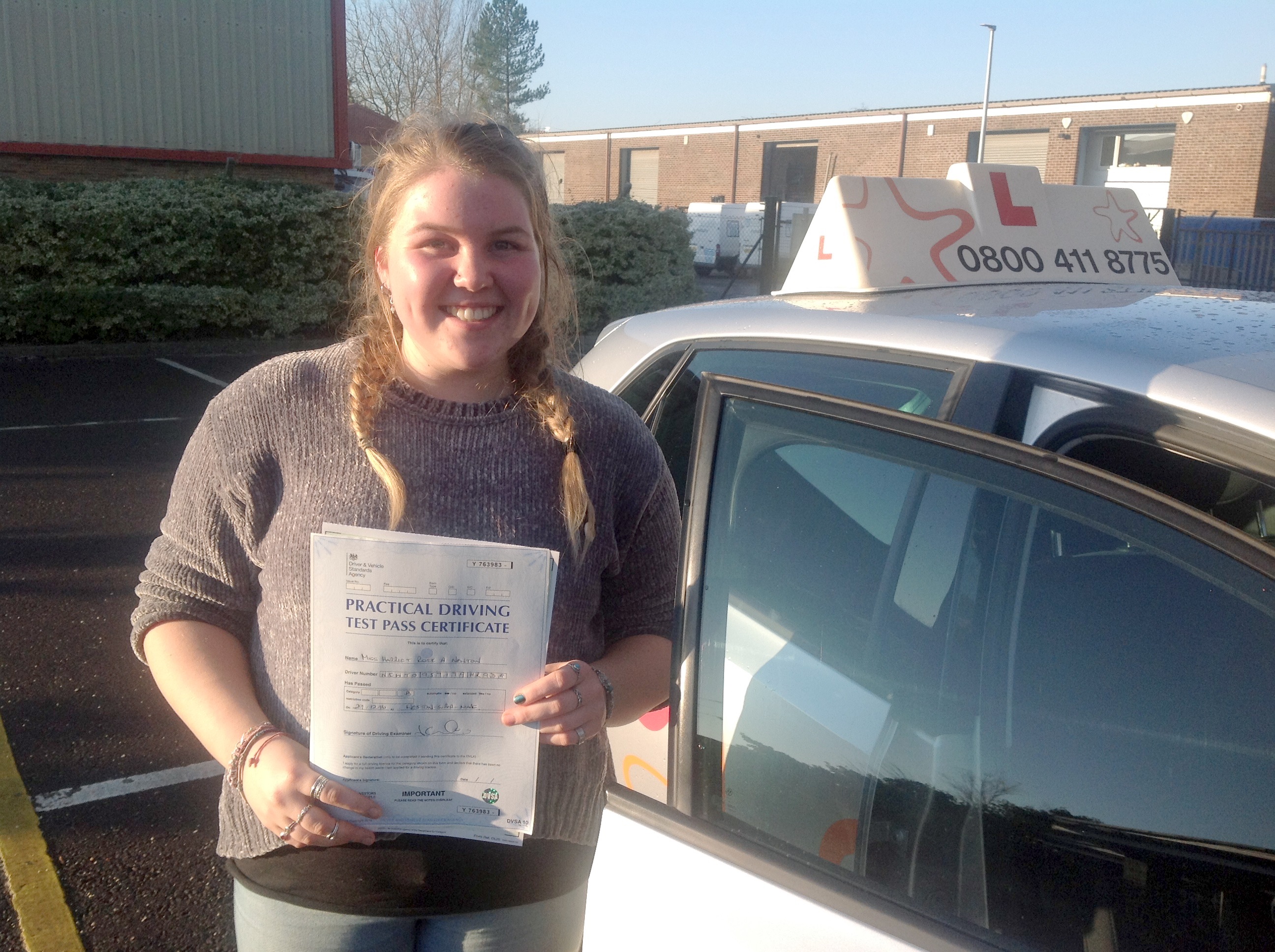 Hattie with her Practical Driving Test Pass Certificate outside Weston-super-mare Driving Test Centre