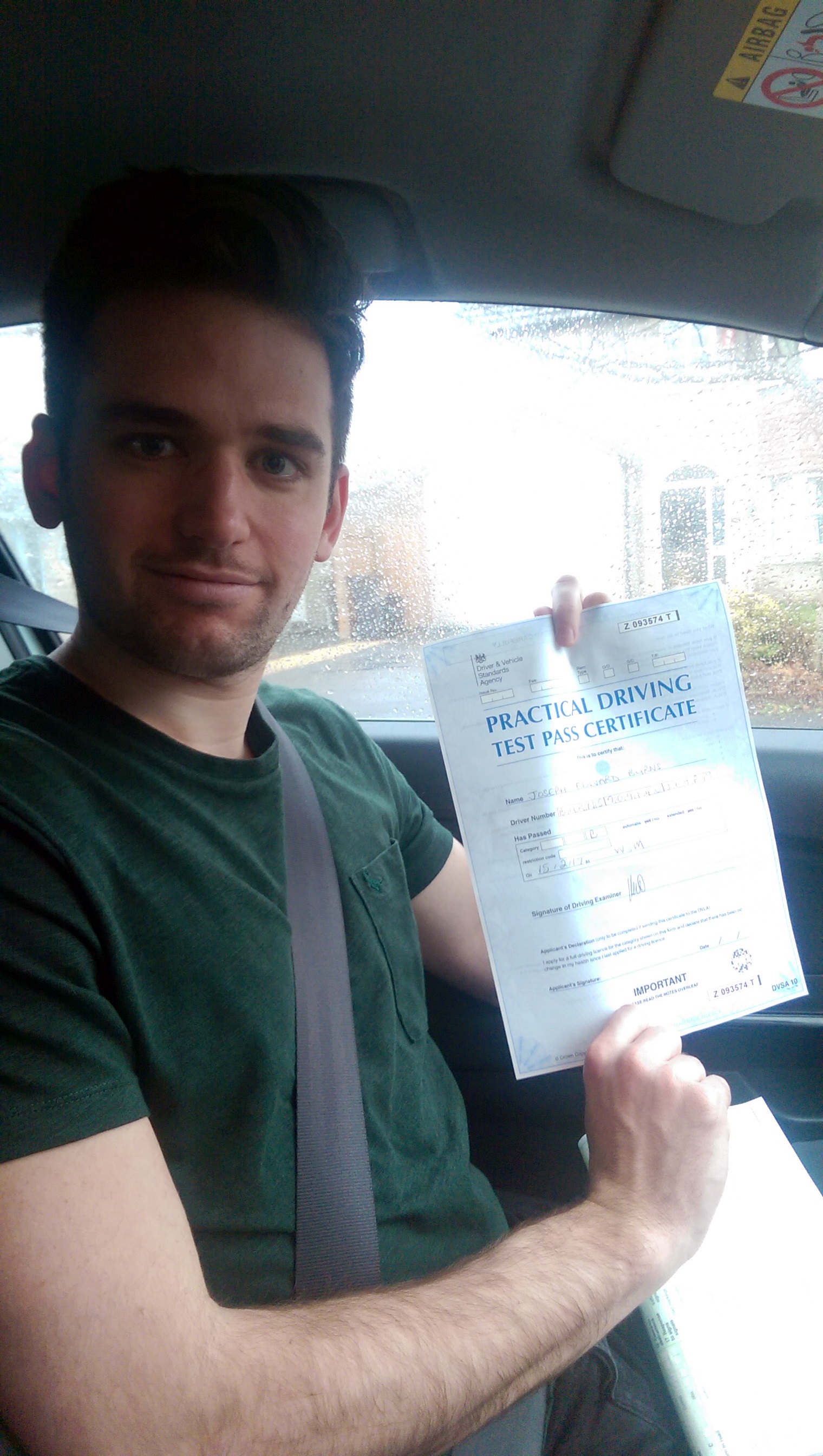 Joe with his Practical Driving Test Pass Certificate.