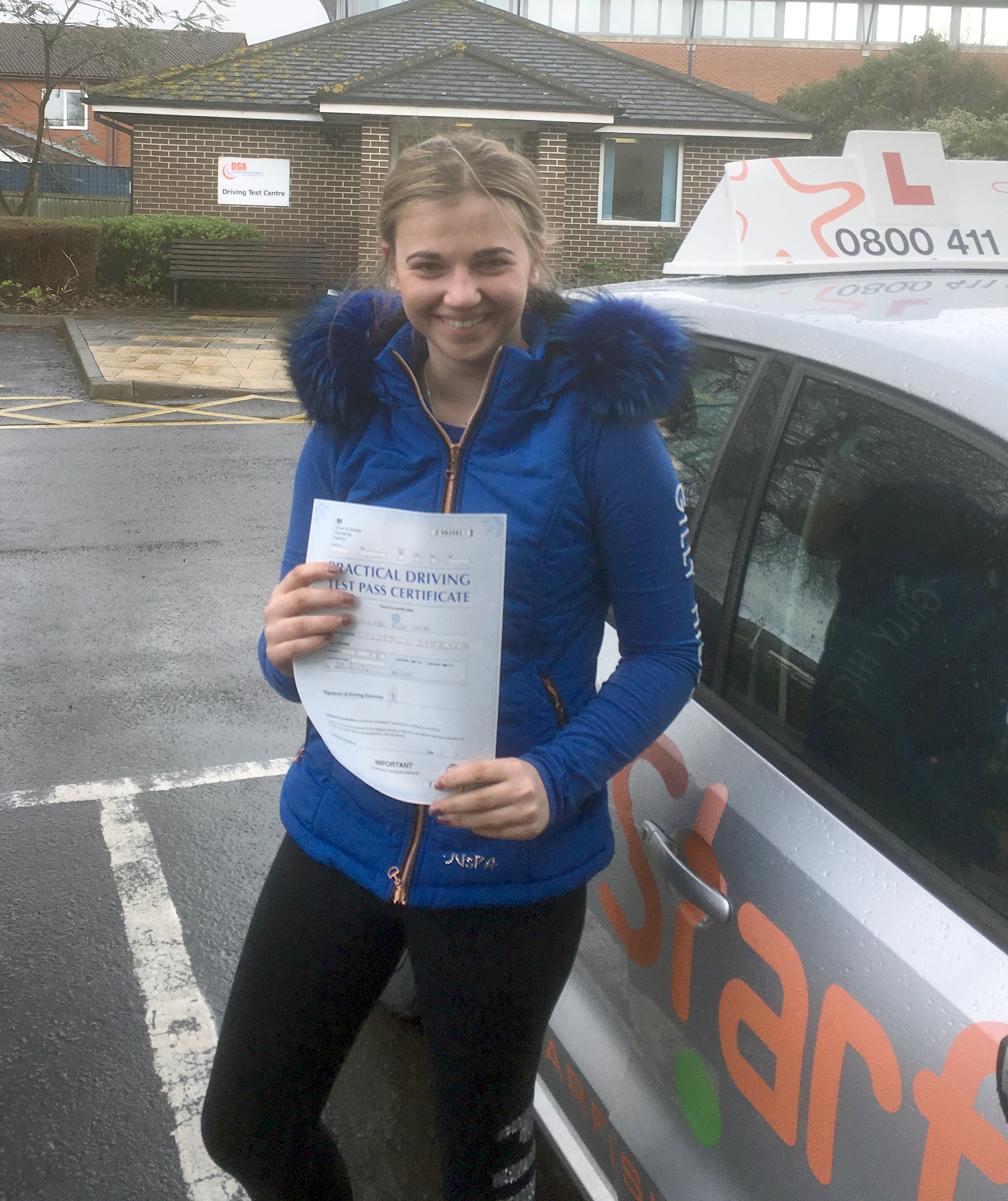 Phoebe with her Practical Driving Test Pass Certificate outside Weston-super-mare Driving Test Centre